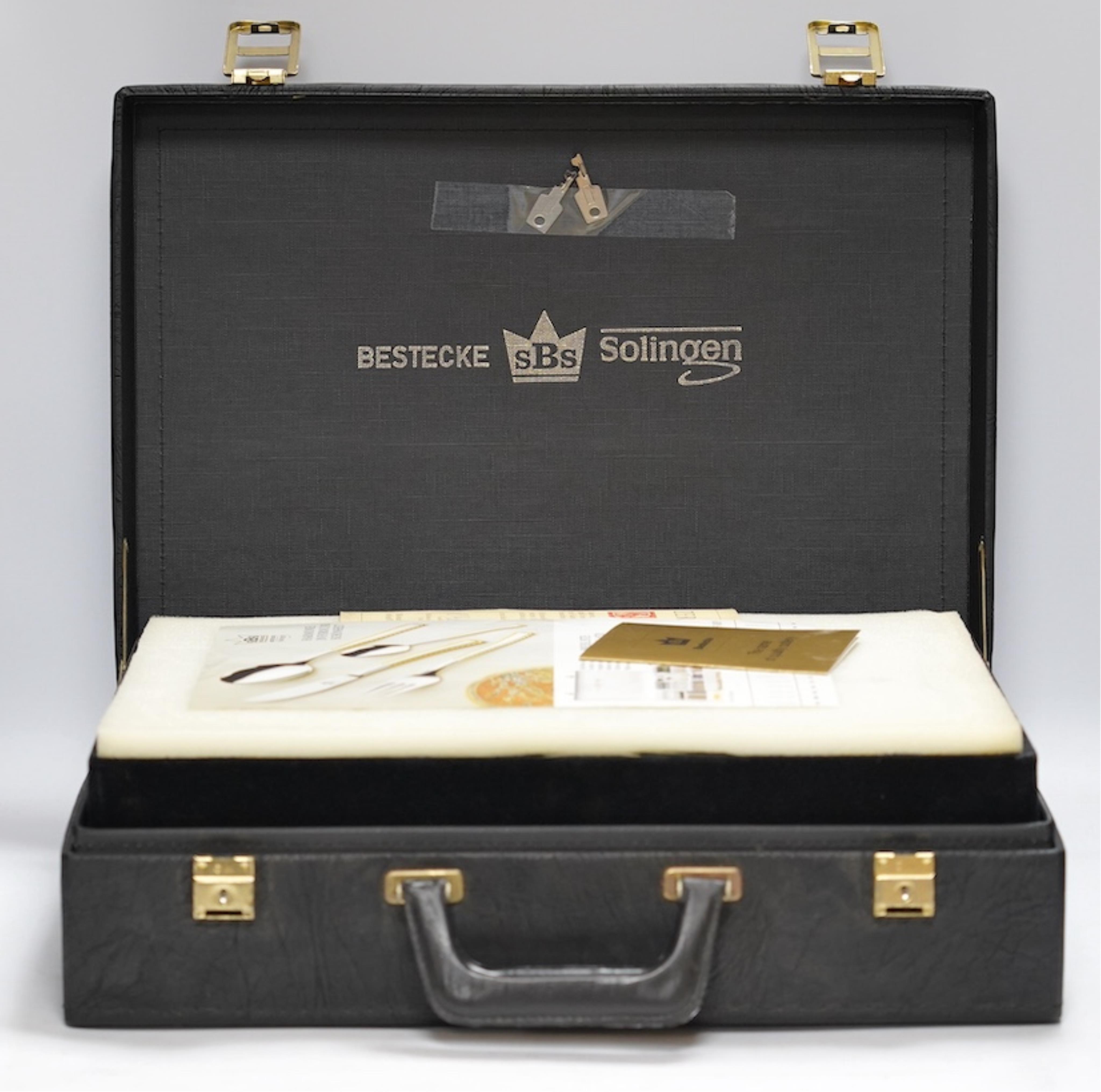 SBS Besteke, Solingen, a suite of plated cutlery. Condition - cutlery good, case in need of a clean